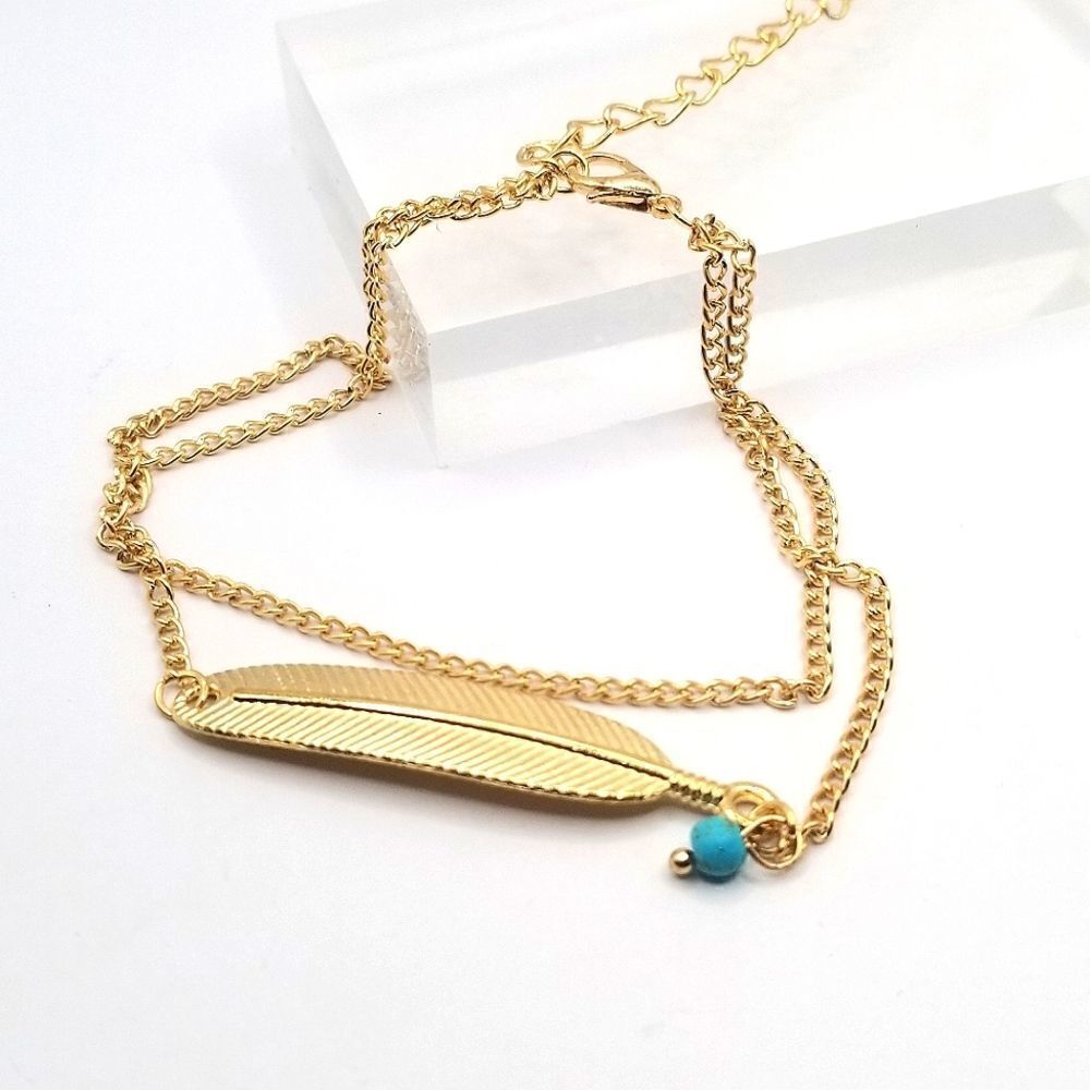 Gold toned layered feather turquoise foot fashion ankle bracelet.